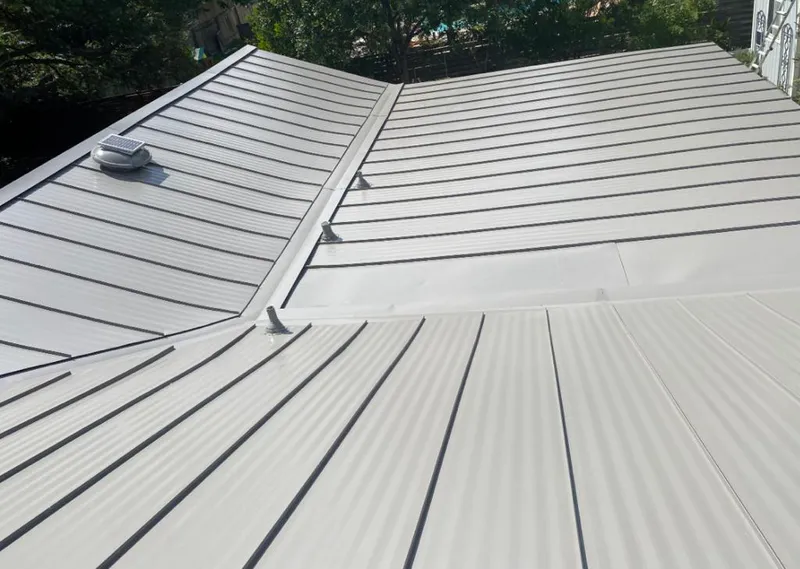 Solar attic fan installed on a metal roof for Roof Ventilation in Sebastian
